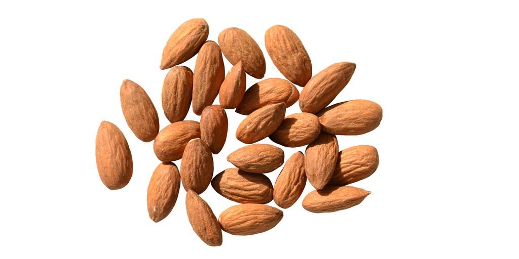 almond oil bottle with measuring tape and almonds