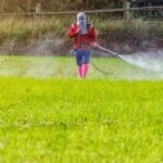 man using spray product confidently